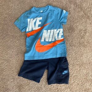 Nike Light Blue and Orange Tee with Dark Blue Shorts